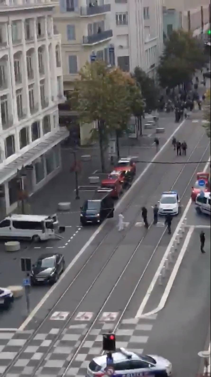 Police officers secure the area after a knife attack in church in Nice