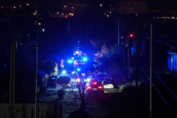 First responders attend the scene of a collision between two trains in the town of Pezinok