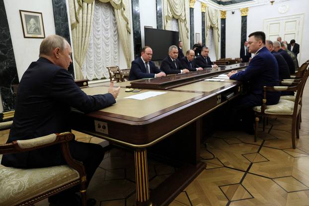 Russian President Vladimir Putin holds a meeting with heads of Russian security services in Moscow