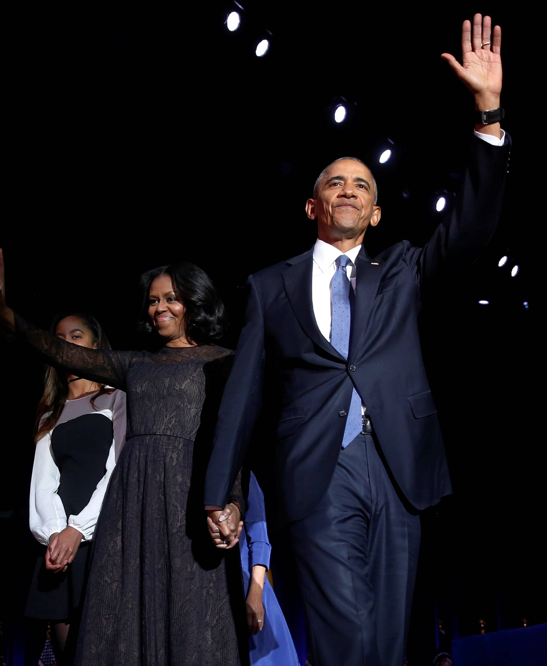 U.S. President Barack Obama (R) is joined onstage by first lady Michelle Obama and daughter Malia, after his farewell address in Chicago