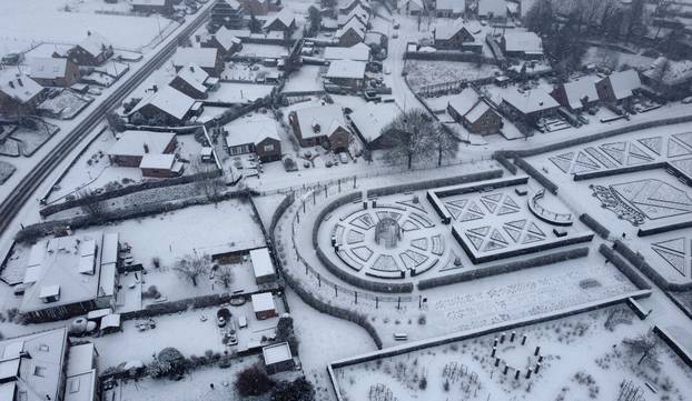 Snow covers the Coloma Rose Garden in Sint-Pieters-Leeuw