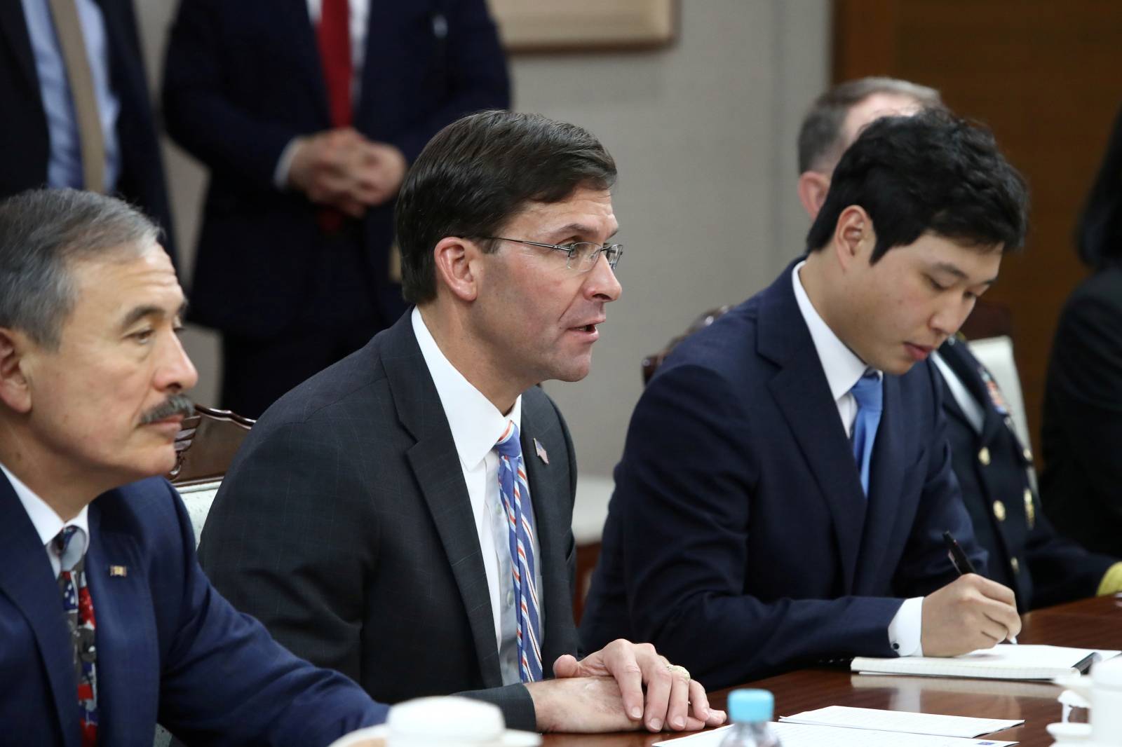 U.S. Defense Secretary Mark Esper talks to South Korean Defense Minister Jeong Kyeong-doo during their meeting in Seoul