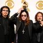 FILE PHOTO: Musicians Tony Iommi, Ozzy Osbourne and Geezer Butler of Black Sabbath pose with their award for Best Metal Performance for "God is Dead?" at the 56th annual Grammy Awards in Los Angeles
