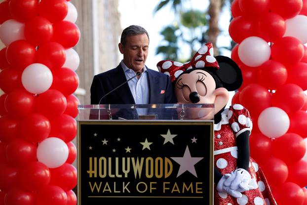 Chairman and CEO of The Walt Disney Company Iger speaks next to the character of Minnie Mouse at the unveiling of her star on the Hollywood Walk of Fame in Los Angeles