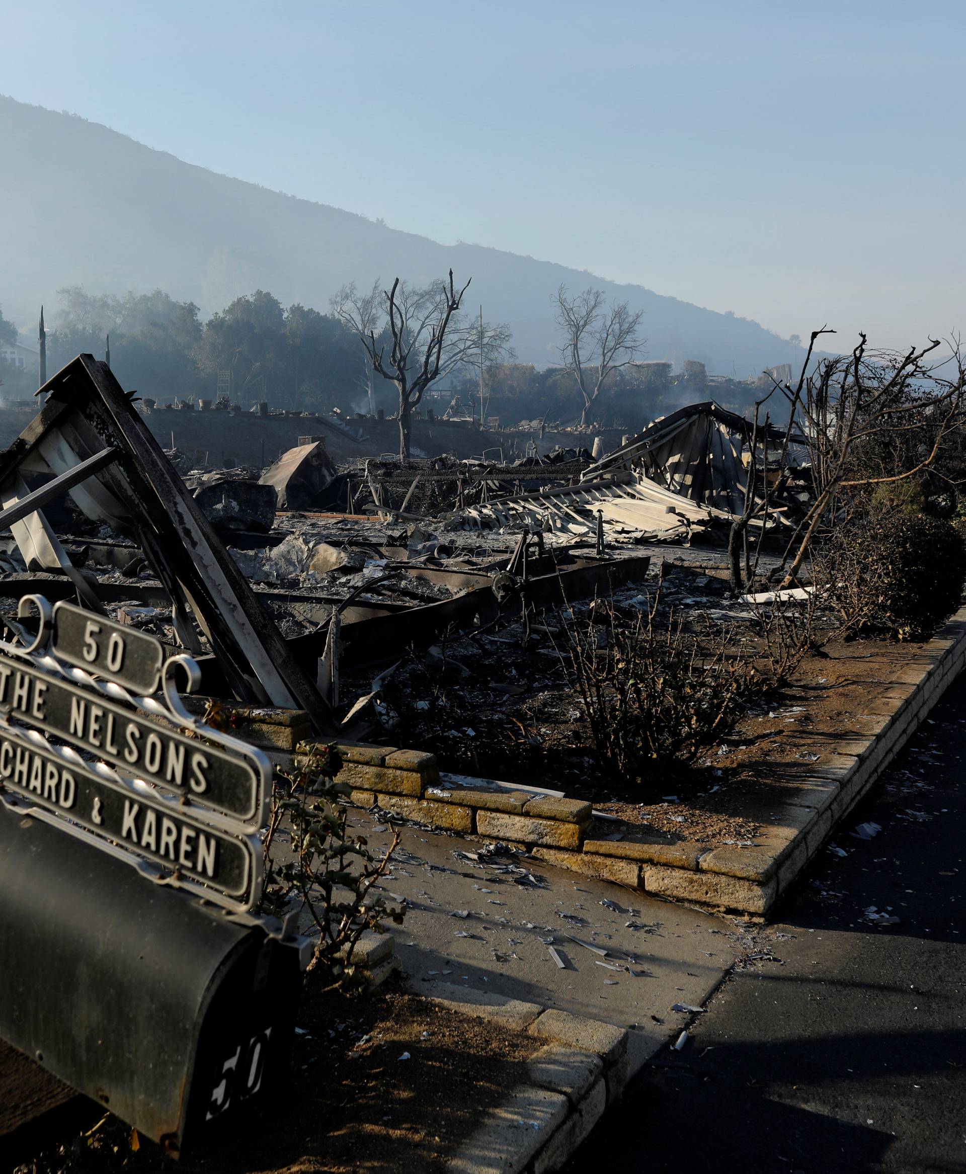 Burned mobile homes are seen at the Monserate Country Club after the Lilac Fire, a fast moving wildfire, swept through their community in Bonsall, California