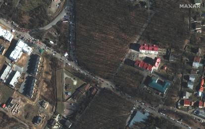 A satellite image shows people and vehicles waiting to cross into Slovakia from Ukraine, at the Vysne Nemecke border crossing