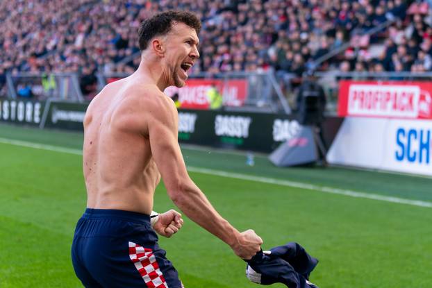 Utrecht, Netherlands. 21st Dec, 2025. UTRECHT, NETHERLANDS - DECEMBER 21: Ivan Perisic of PSV celebrates after scoring the team's second goal during the Dutch Eredivisie match between FC Utrecht and PSV at Stadion Galgenwaard on December 21, 2025 in Utrec