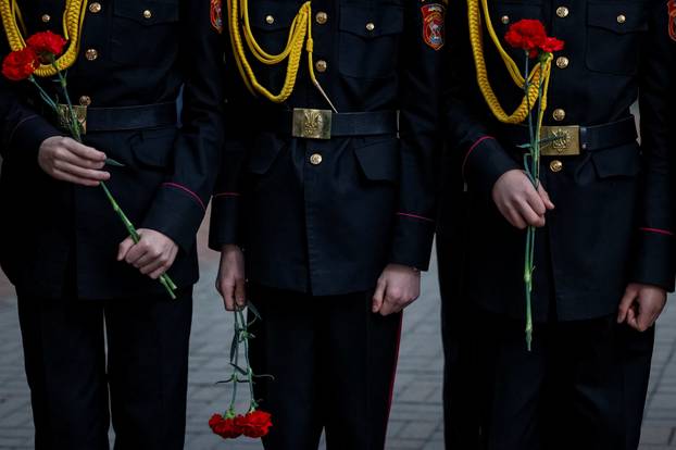 People attend a ceremony marking the anniversary of the Chornobyl nuclear disaster in Kyiv