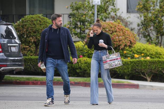 *EXCLUSIVE* Ben Affleck and Jennifer Lopez hold hands as they start off their day with coffee to go.