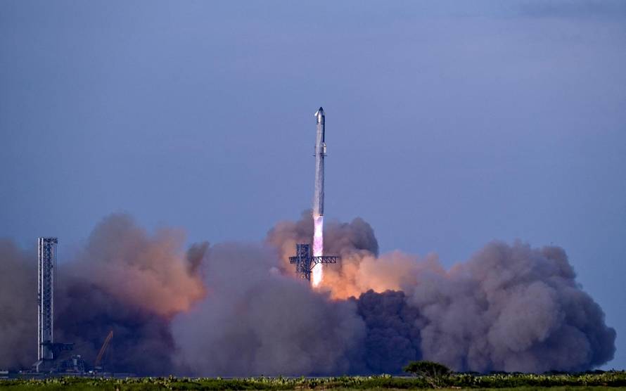 A SpaceX Super Heavy booster carrying the Starship spacecraft lifts off on its 10th test flight
