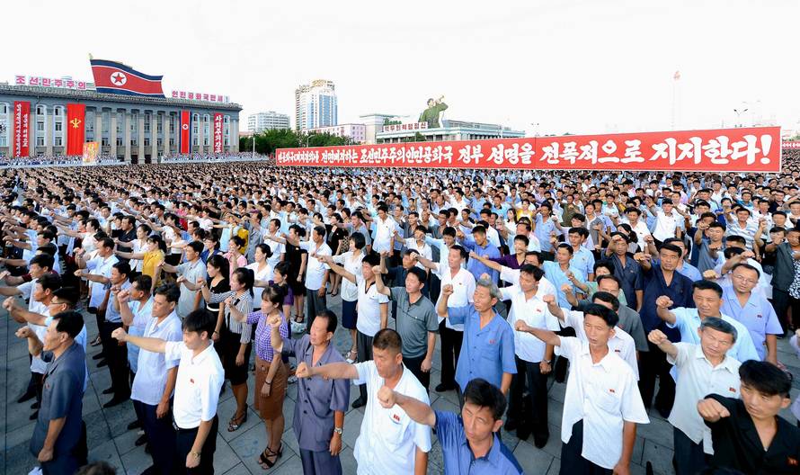 People participate in a Pyongyang city mass rally held at Kim Il Sung Square to fully support the statement of the DPRK government