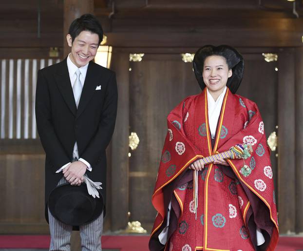 Japanese Princess Ayako and her husband Kei Moriya answer reporters