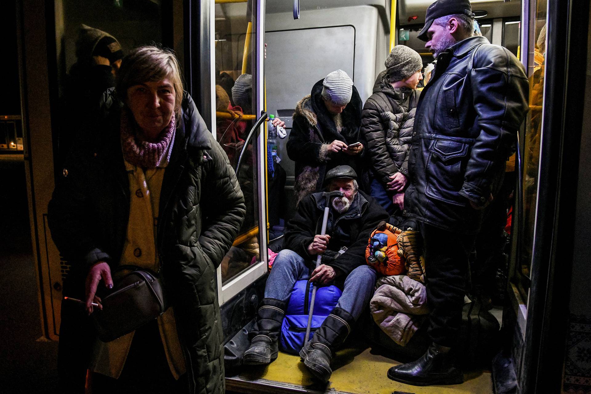 People wait inside an evacuee bus after fleeing from Mariupol to Zaporizhzhia