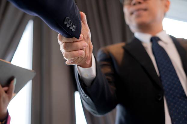 Successful,Close,Up,Hand,Asian,Businessman,Handshake,With,Partnership,During