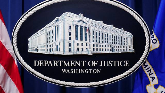 FILE PHOTO: U.S. Justice Department logo is seen at Justice Department headquarters in Washington