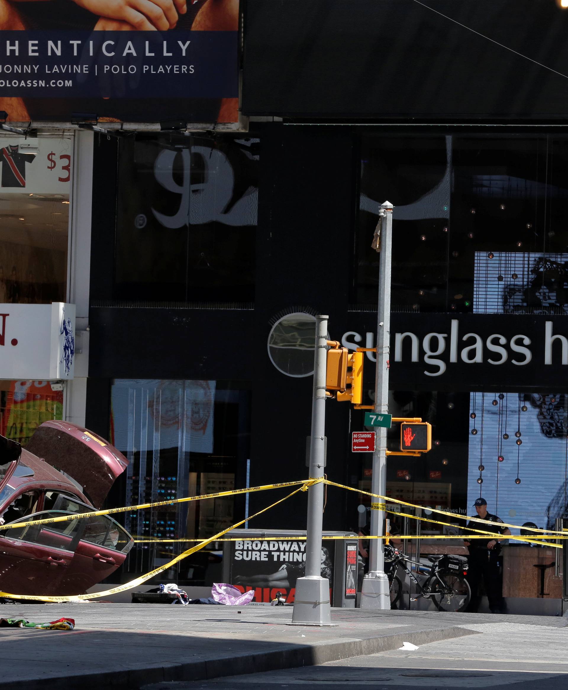 The vehicle that drove onto sidewalk and struck pedestrians is seen in Times Square in New York