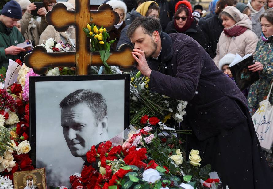 People mark first anniversary of Russian opposition leader Navalny's death at Moscow cemetery