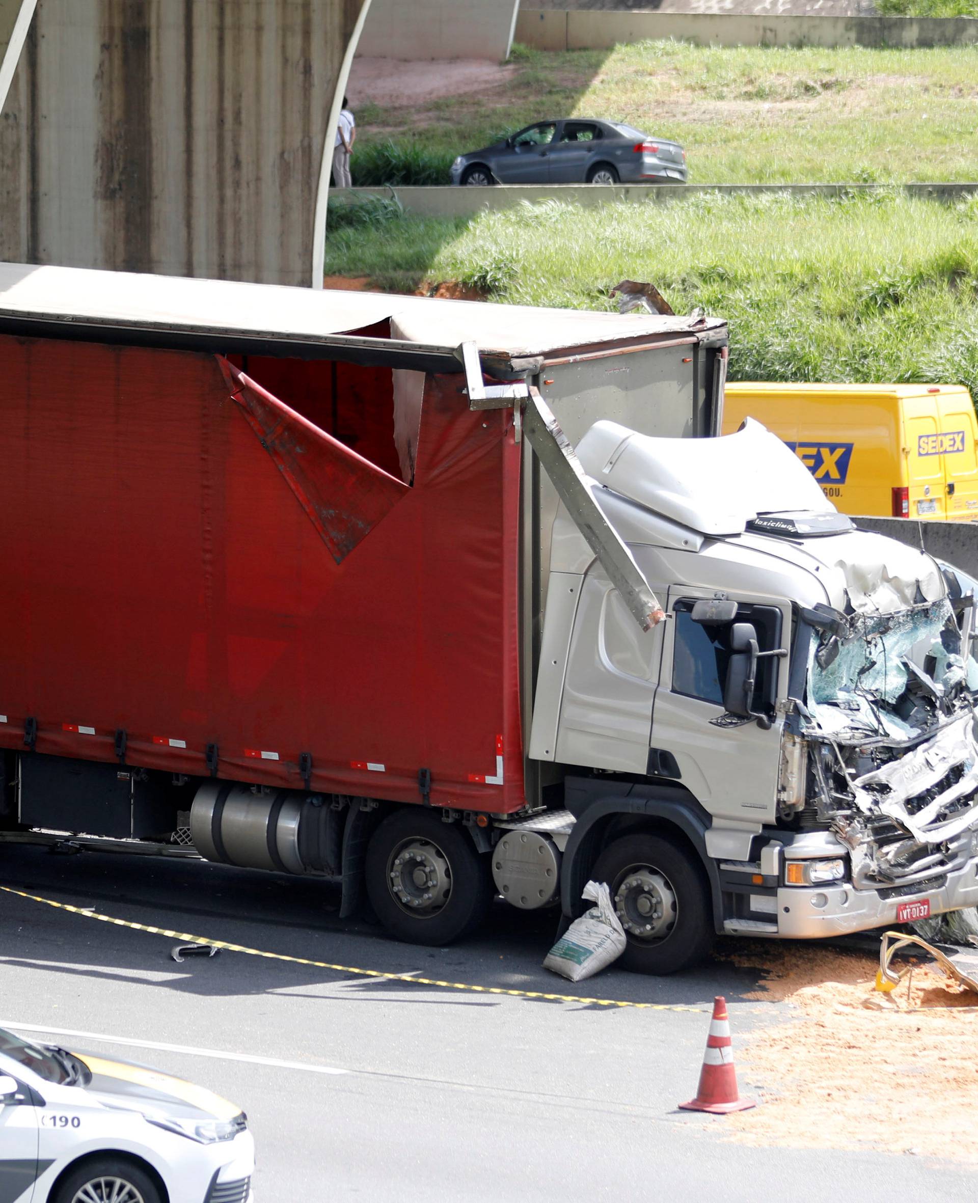 Wreckage of a helicopter and a truck that have crashed are seen on Anhanguera Highway, in SÃ£o Paulo