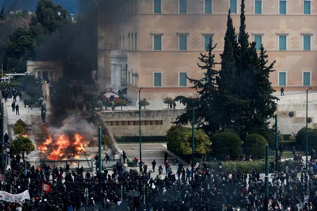 People gather in front of the Greek parliament during a protest, in Athens