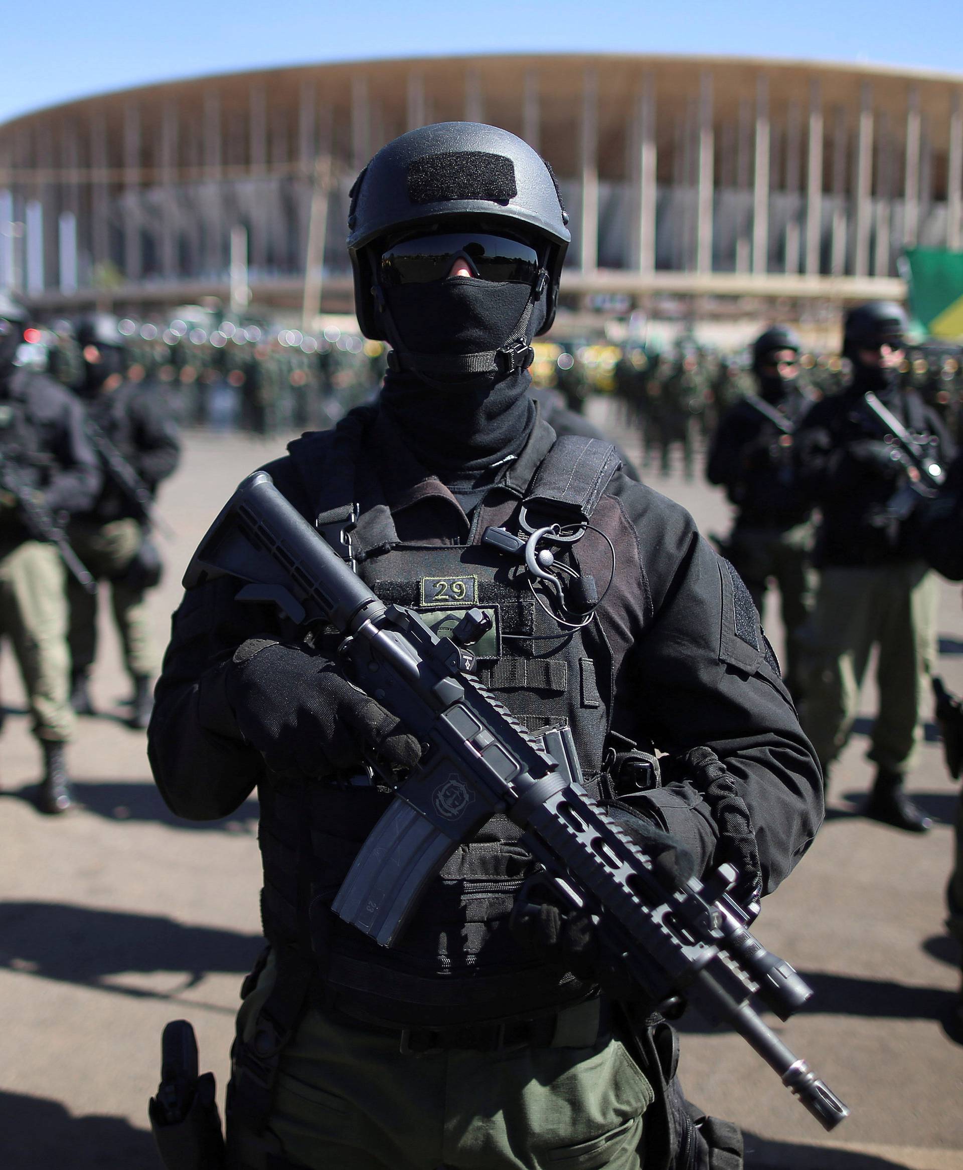 Brazilian police and special military forces stand outside the Mane Garrincha Stadium in Brasilia