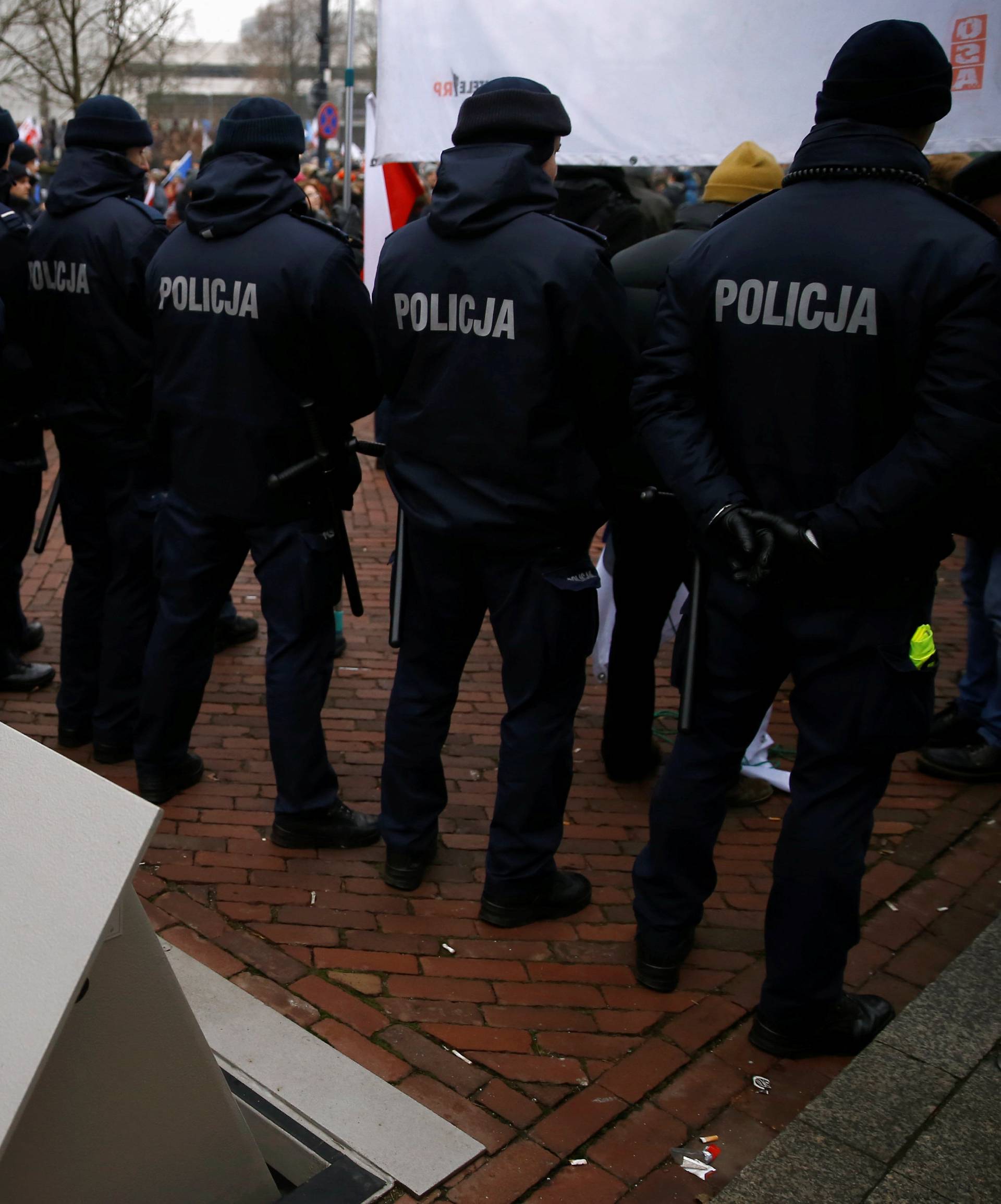 Police block access to the Parliament building during a protest in Warsaw
