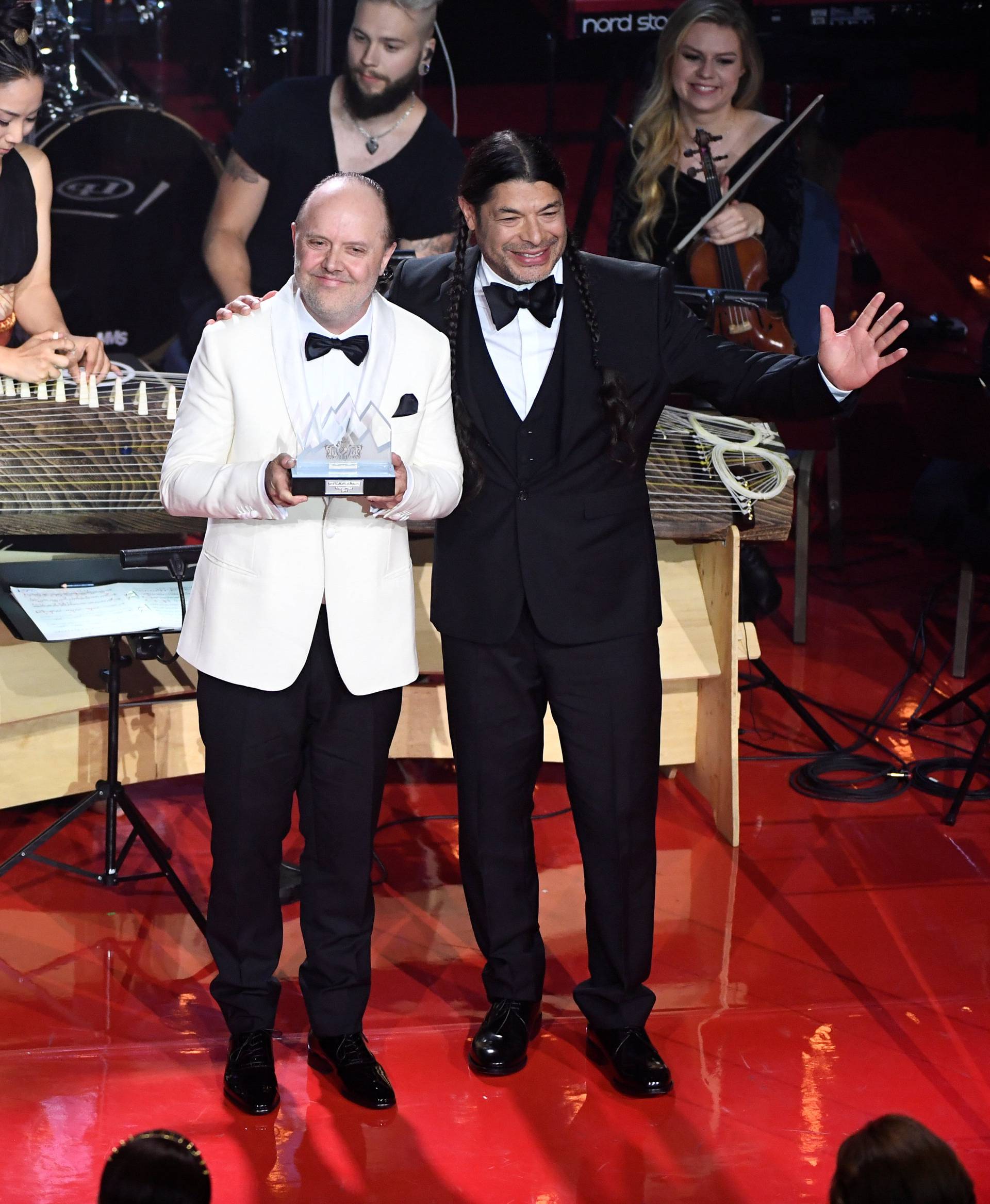 King Carl Gustaf of Sweden gives out the Polar Music Prize to Lars Ulric and Robert Trujillo in Metallica during an award cermony at Grand Hotel in Stockholm