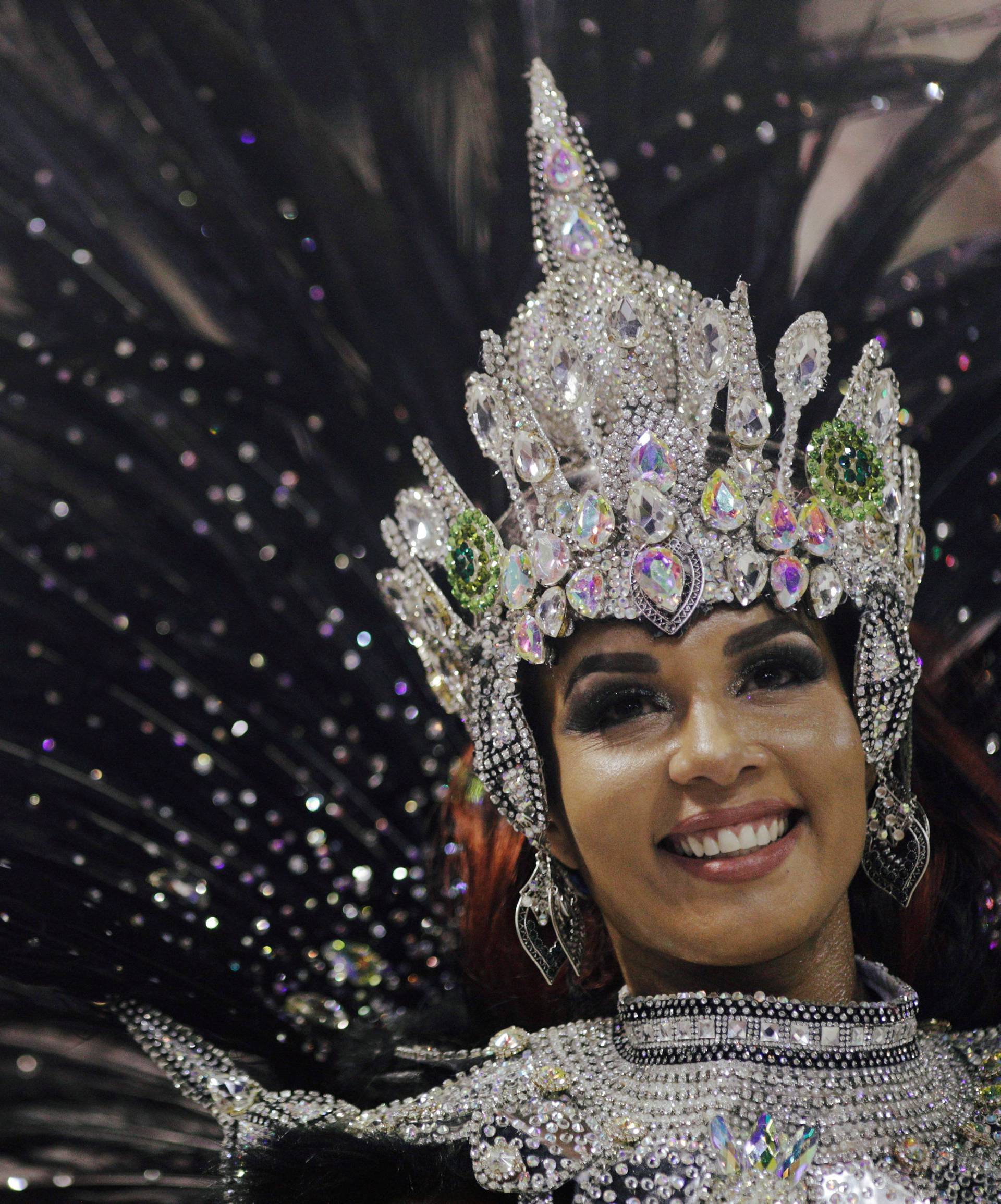 Drum queen Milena Nogueira from Imperio Serrano samba school performs during the first night of the Carnival parade at the Sambadrome in Rio de Janeiro