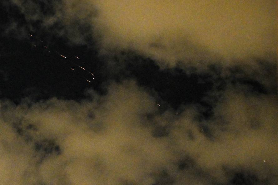 An Iranian missile with cluster munitions flies toward Israel, as seen from Tel Aviv