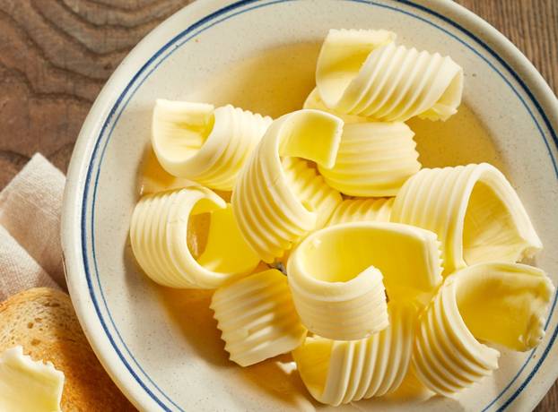 Dish of butter curls with crispy golden toast