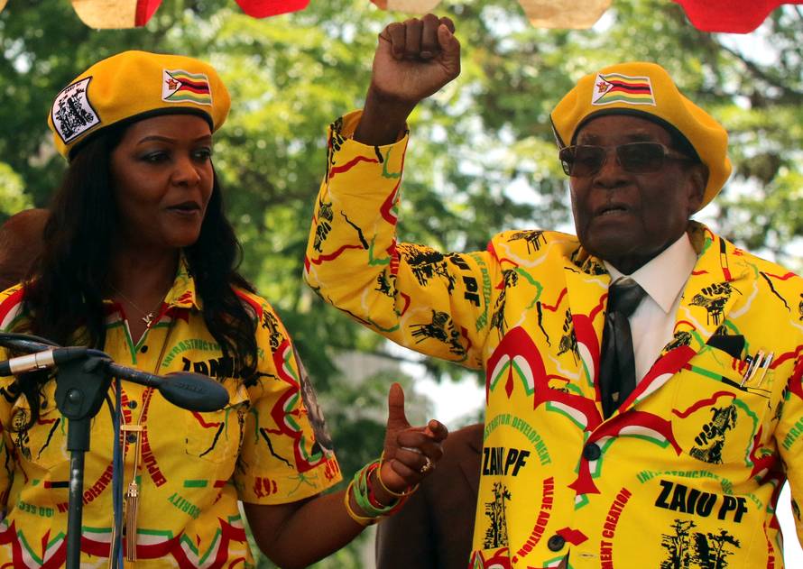President Robert Mugabe and his wife Grace Mugabe attend a rally of his ruling ZANU-PF party in Harare