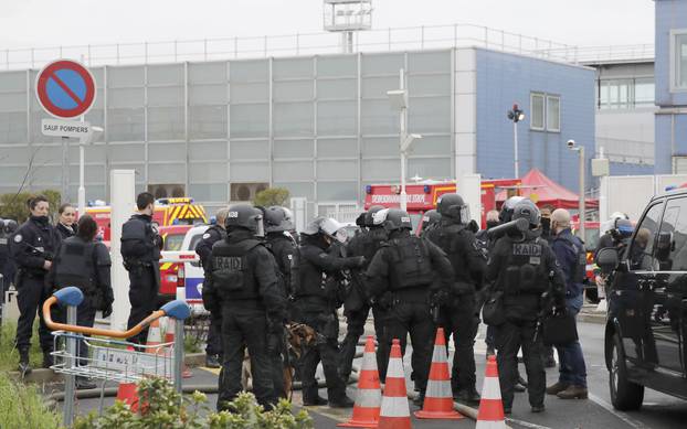 Police take up position at Orly airport southern terminal after shooting incident near Paris