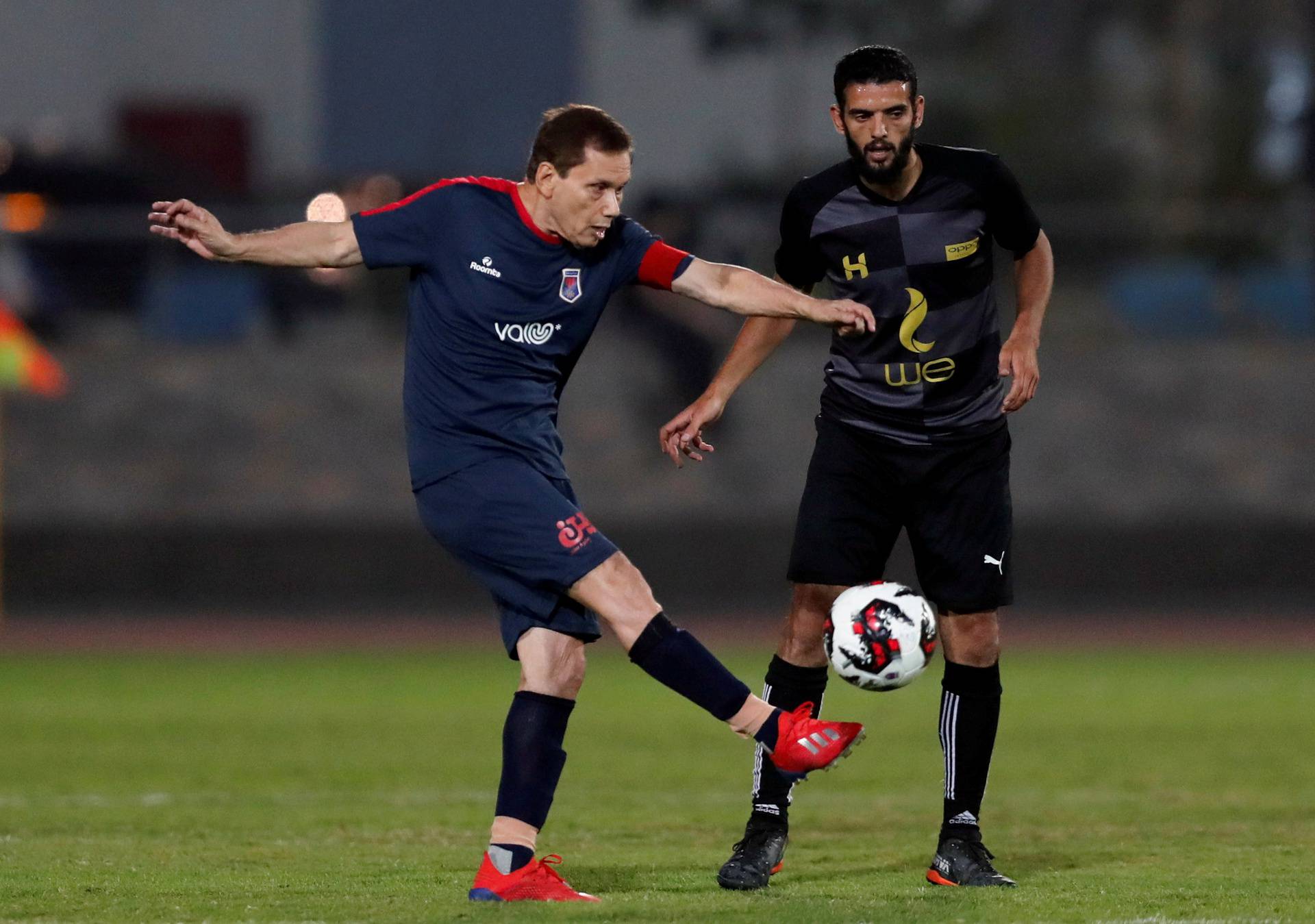 Ezzeldin Bahader, a 74-years-old Egyptian football player of 6th October Club is seen in action during a soccer match against El Ayat Sports Club of Egypt's third division league at the Olympic Stadium in the Cairo suburb of Maadi