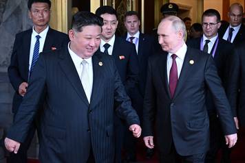 Russian President Vladimir Putin meets with North Korean leader Kim Jong Un in Beijing
