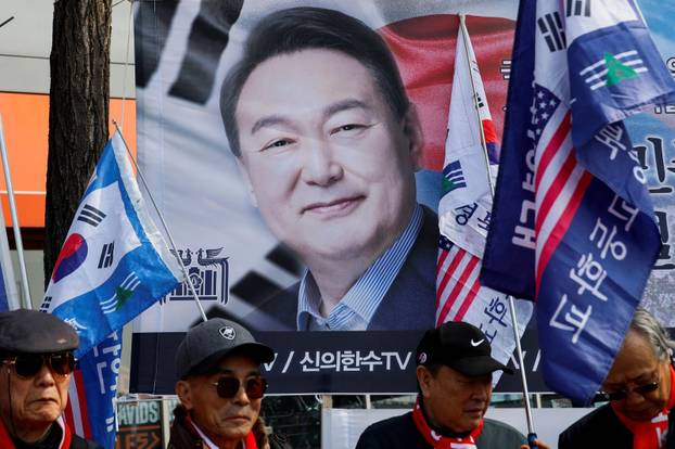 Far-right demonstrators gather as they wait for the Constitutional Court ruling on President Yoon Suk Yeol's impeachment, near his residence in Seoul