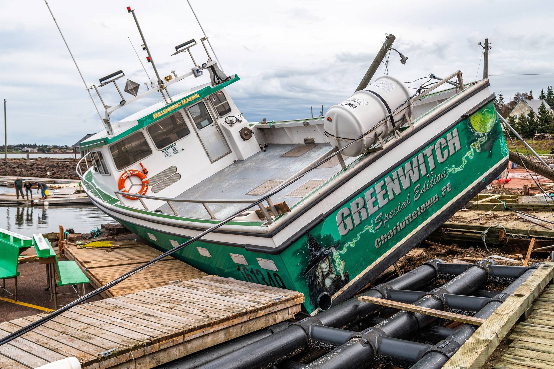 A lobster boat beached during Hurricane Fiona is seen at Stanley Bridge Marina