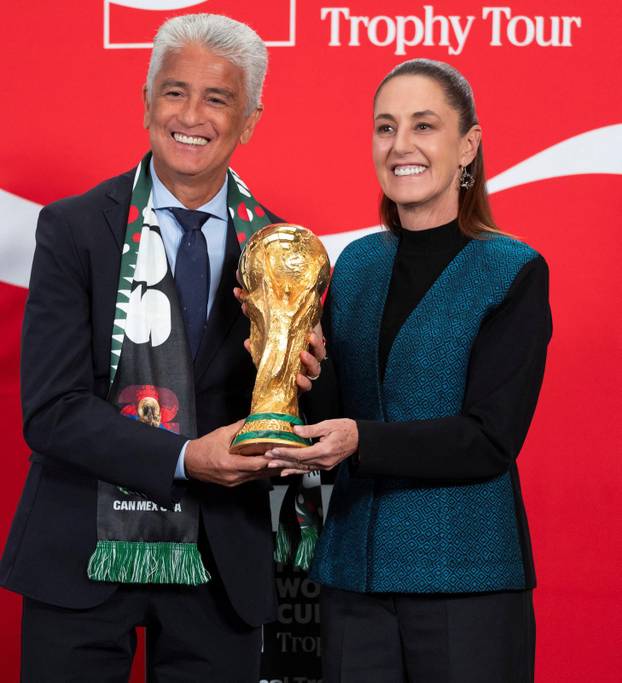 Mexican President Claudia Sheinbaum holds FIFA World Cup trophy at National Palace