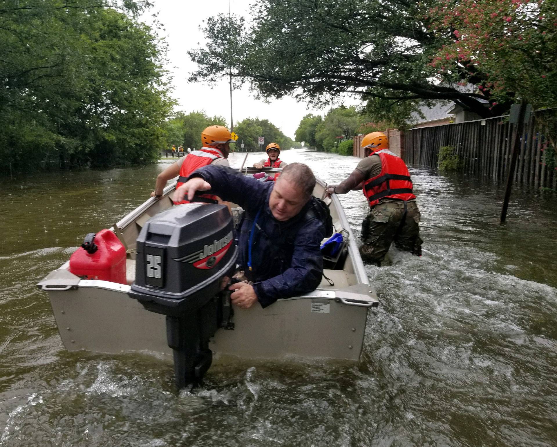 Handout photo of Texas National Guard soldiers search by boat for stranded residents in heavily flooded areas from the storms of Hurricane Harvey in Houston