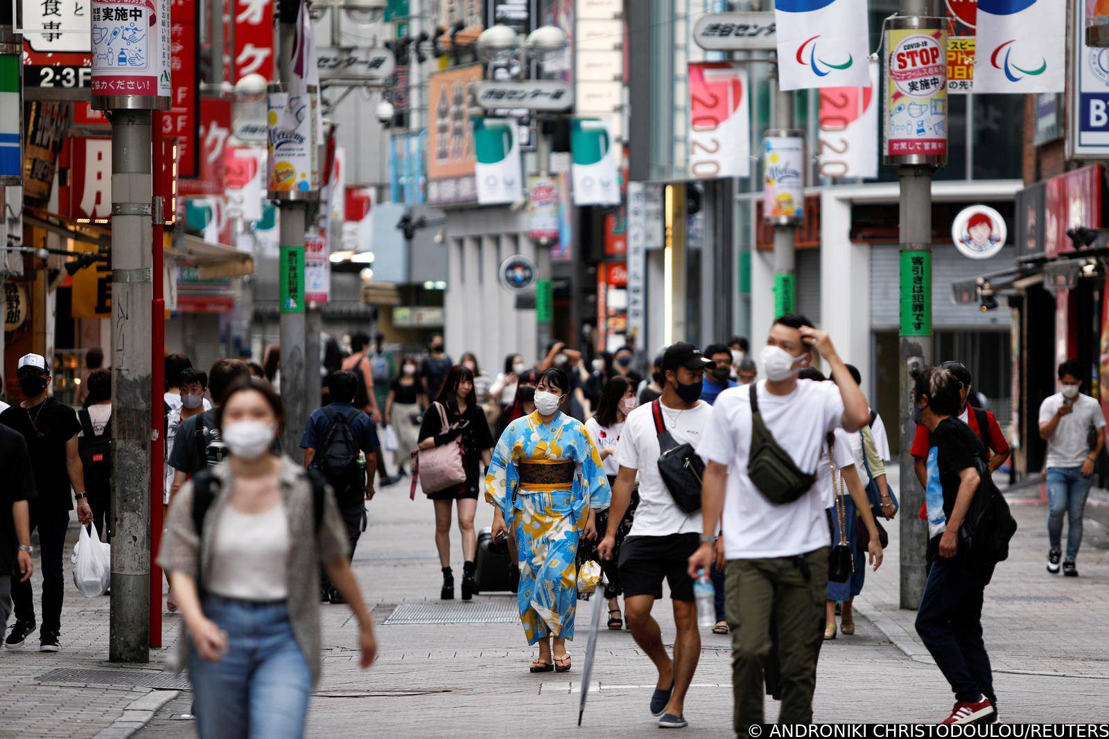 People walk in Shibuya shopping area, amid COVID-19 outbreak, in Tokyo
