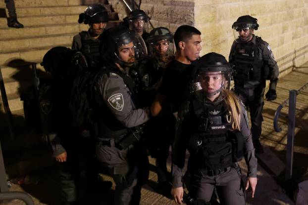 Israeli Border Police force detain a Palestinian protestor during clashes at Damascus Gate by the entrance to Jerusalem