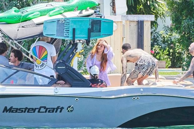 Shakira enjoys a barefoot trip with a boatload of male pals including F1 star Lewis Hamilton Miami as rumors swirl over possible Tom Cruise romance.