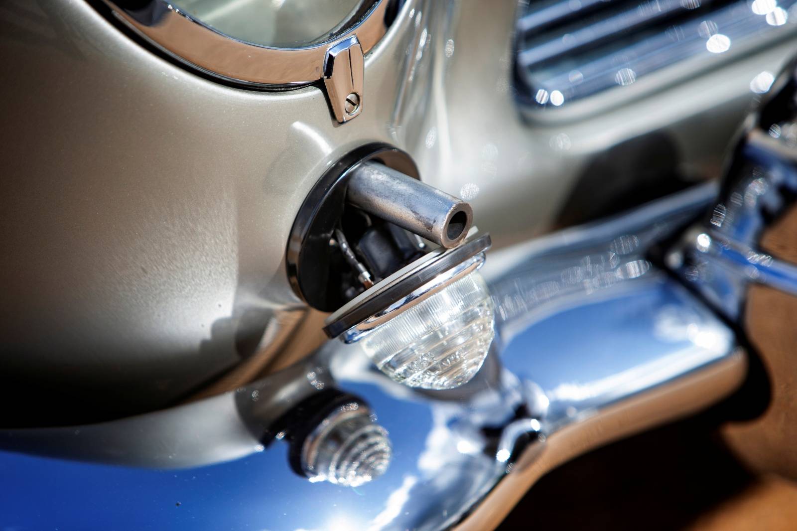 Handout photo of the detail of a gun turret shown in the front fender of an original Aston Martin DB5 James Bond car