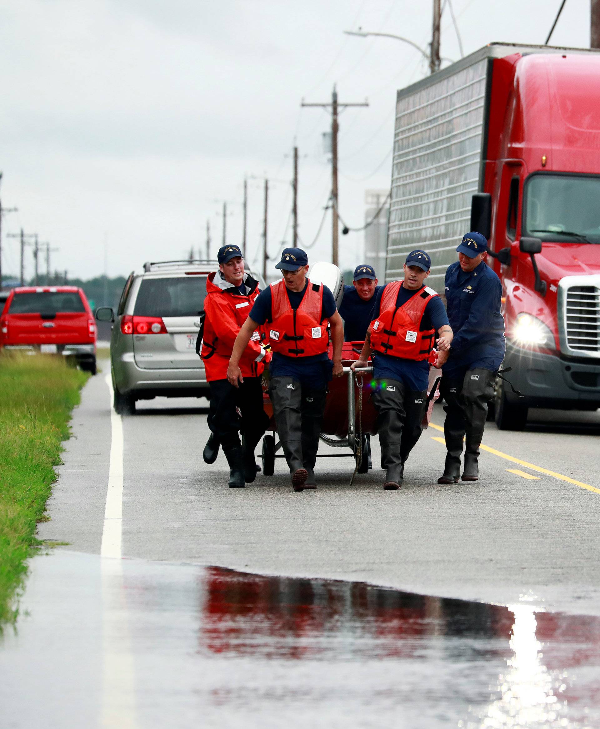 Members of the Coast Guard launch a rescue boat to help a stranded motorist in the flood waters caused by Hurricane Florence in Lumberton.