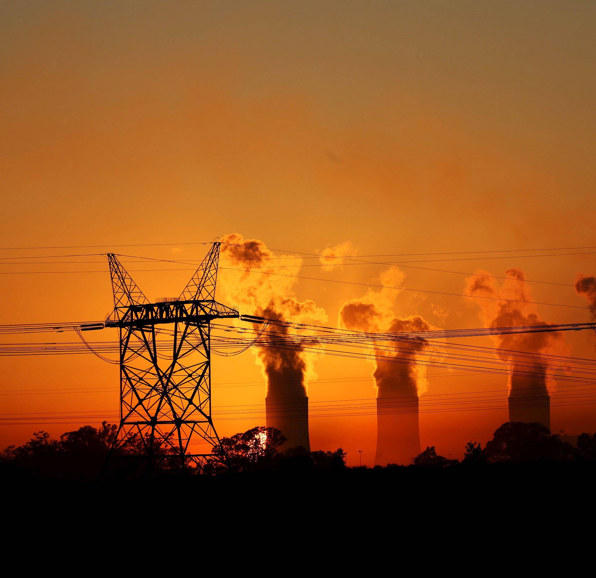 Electricity pylons are seen in front of the cooling towers at the Lethabo Thermal Power Station,an Eskom coal-burning power station near Sasolburg in the northern Free State province