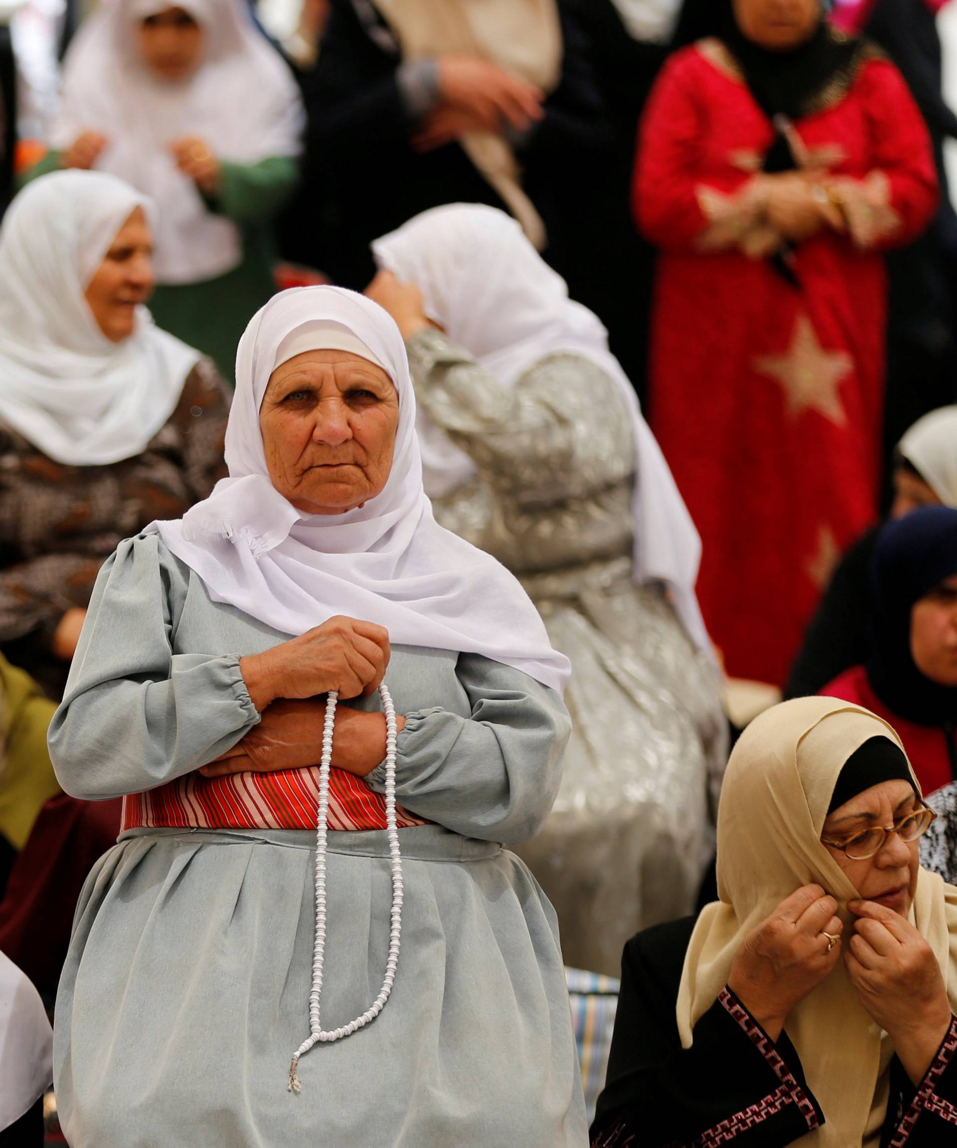 Palestinian women pray on the first Friday of the holy fasting month of Ramadan on the compound known to Muslims as Noble Sanctuary and to Jews as Temple Mount in Jerusalem's Old City