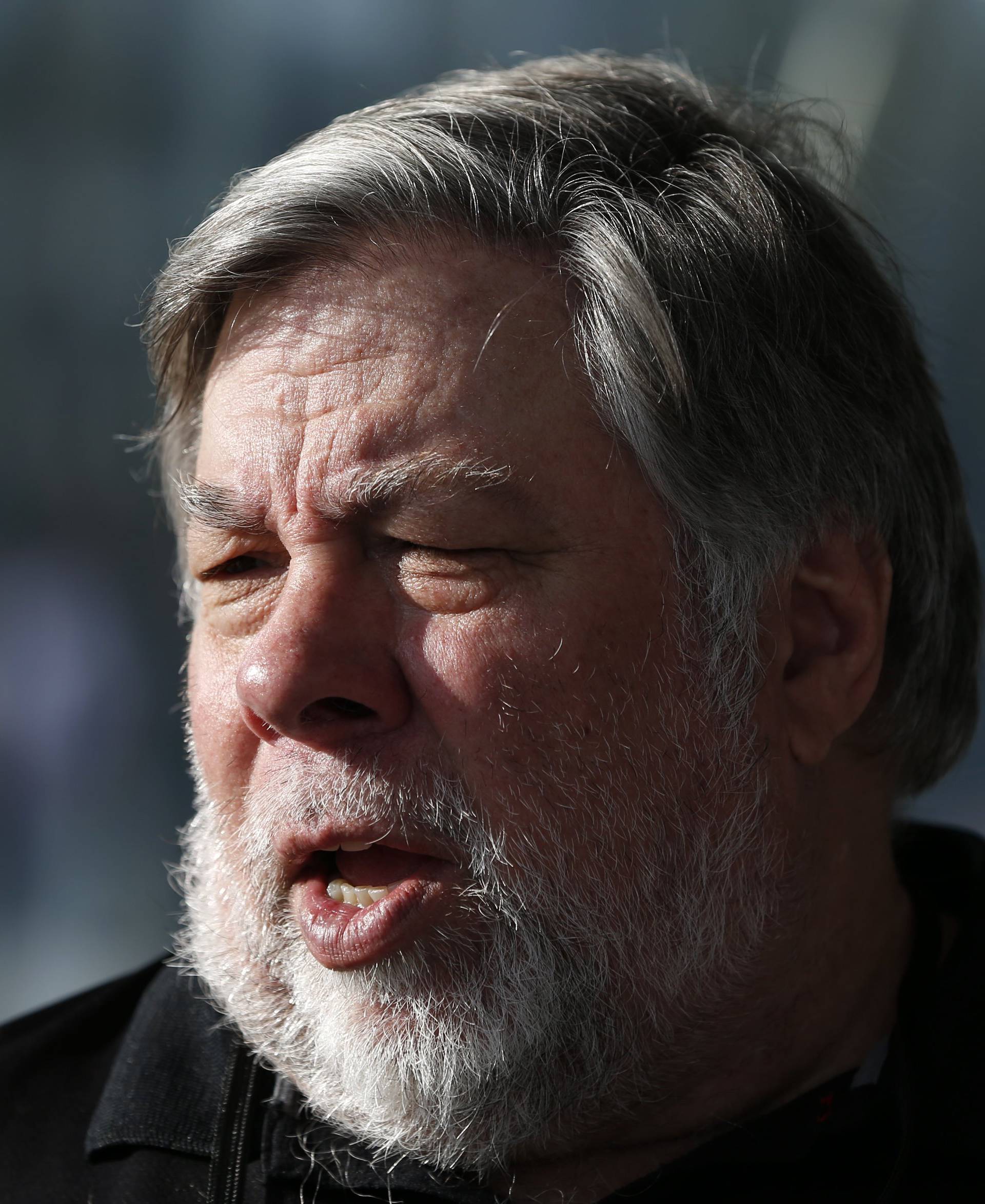 Steve Wozniak, co-founder of Apple, talks to people during a launch event in Cupertino
