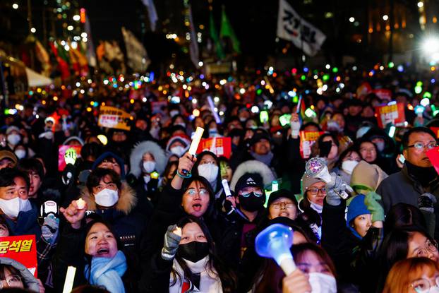 Protesters take part in a rally calling for the impeachment of South Korean President Yeol, in Seoul