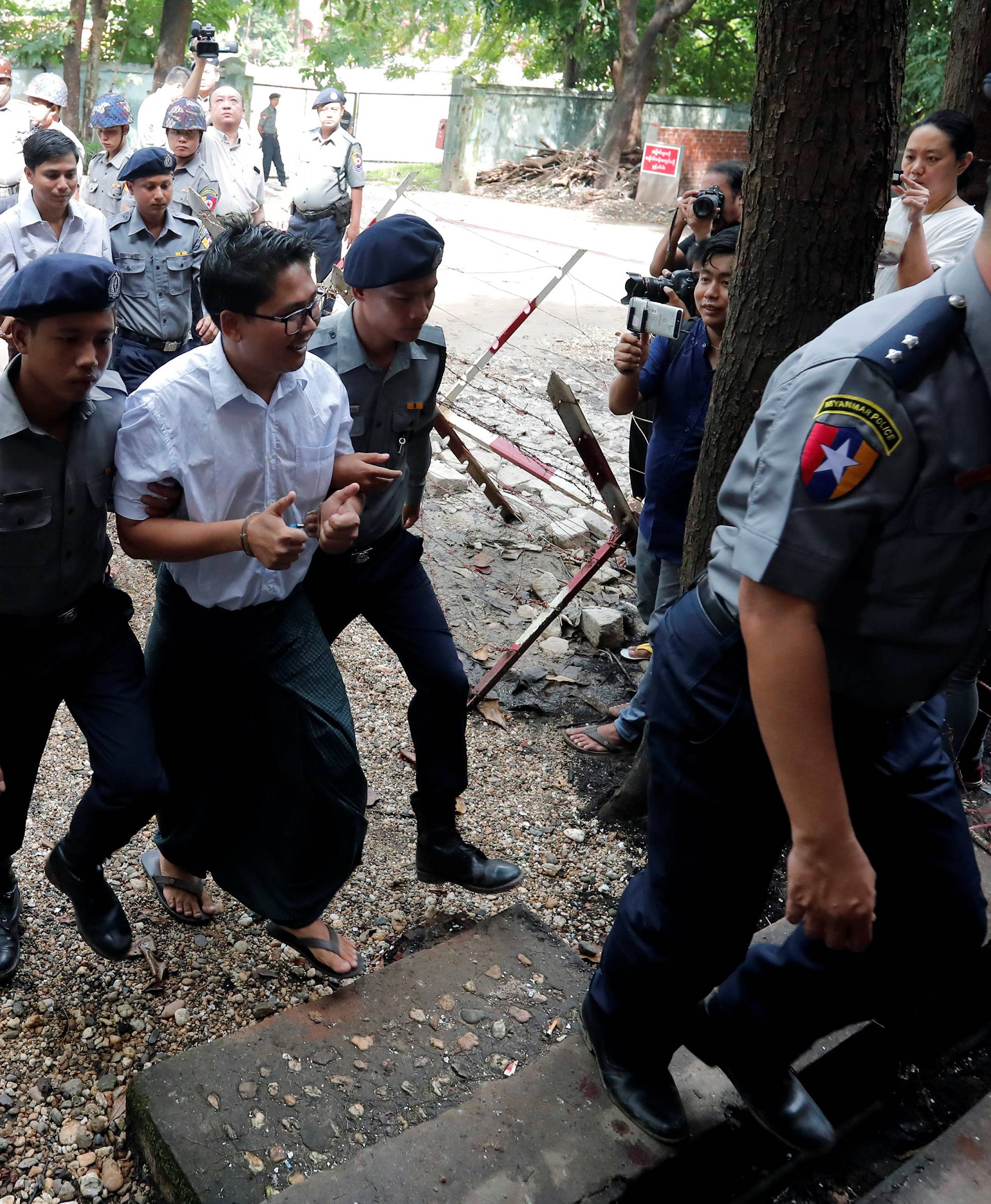 Detained Reuters journalists Wa Lone and Kyaw Soe Oo arrive to listen to their verdict in Yangon