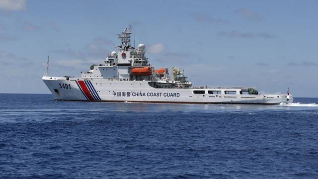 FILE PHOTO: A Chinese Coast Guard vessel is pictured on the disputed Second Thomas Shoal, part of the Spratly Islands, in the South China Sea