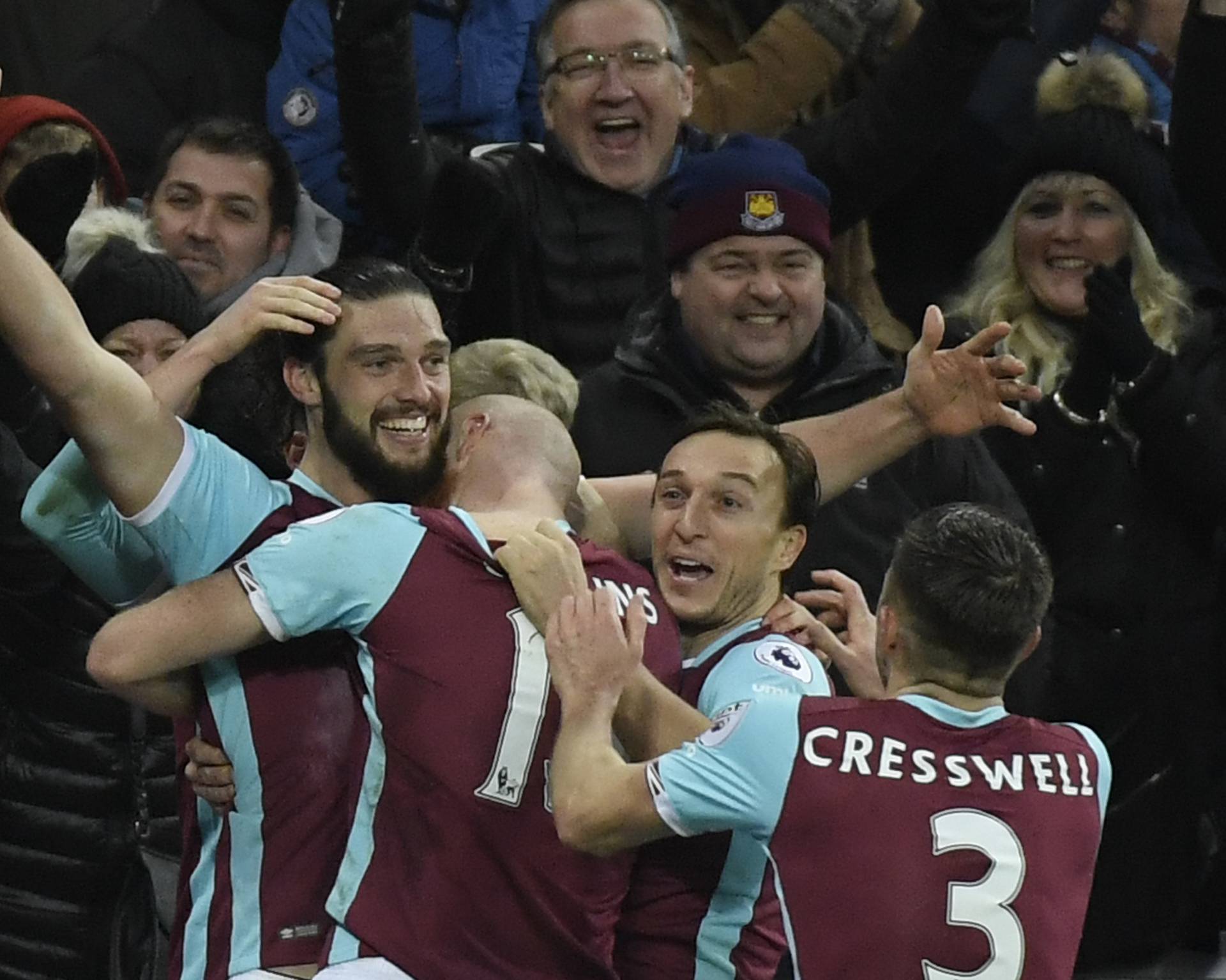 West Ham United's Andy Carroll celebrates scoring their second goal with teammates