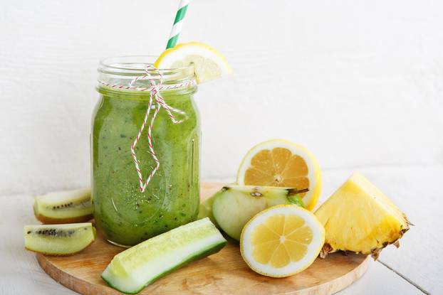 Fresh organic green smoothie with salad, apple, cucumber,